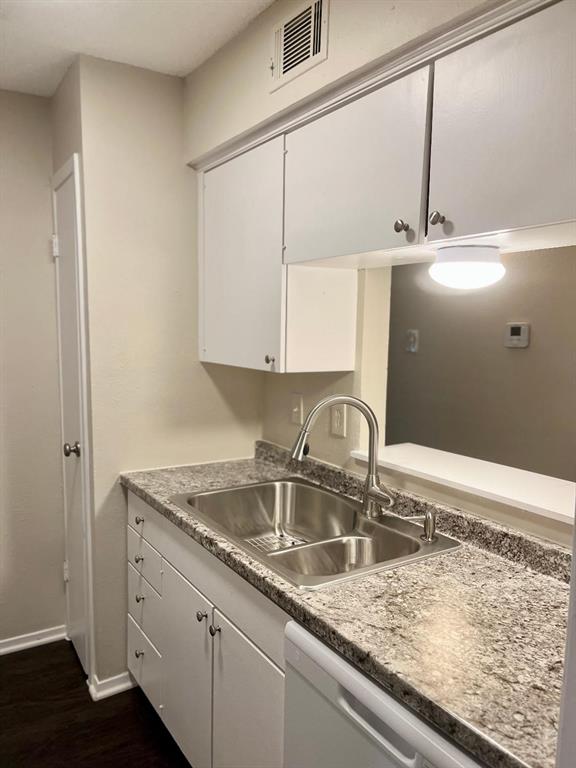 4851 Cedar Springs Road, Unit 391 Dallas, TX 75219 - Photo 5 of 14 a kitchen with a sink and cabinets