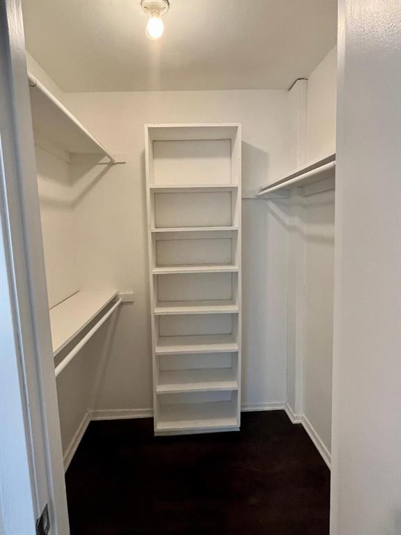 4851 Cedar Springs Road, Unit 391 Dallas, TX 75219 - Photo 7 of 14 a view of walk in closet with empty racks