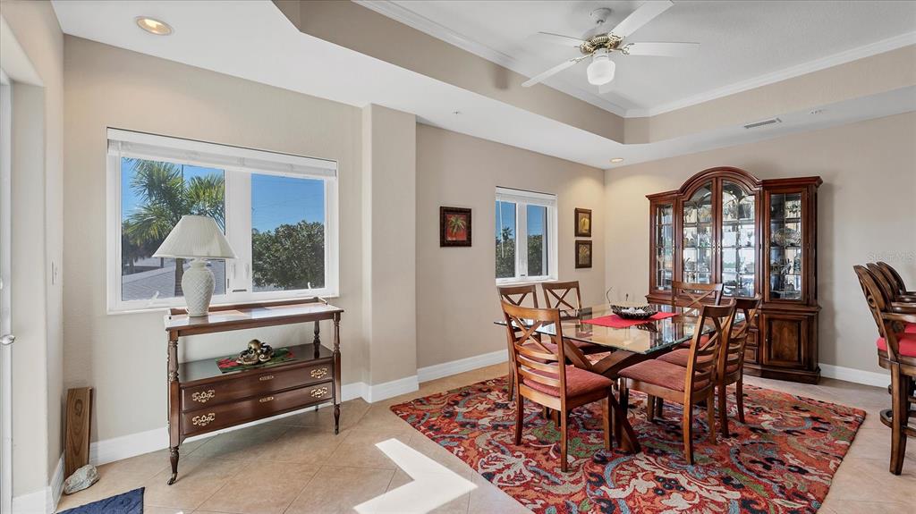 2245 North Beach Road, Unit 203 Englewood, FL 34223 - Photo 11 of 55 a dining room with furniture and window