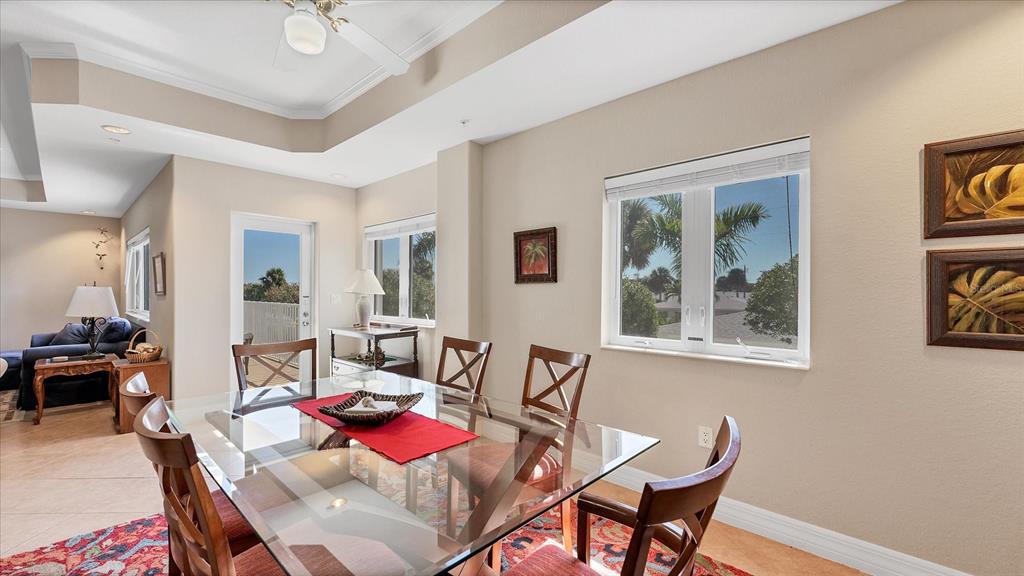 2245 North Beach Road, Unit 203 Englewood, FL 34223 - Photo 12 of 55 a living room with furniture and a potted plant