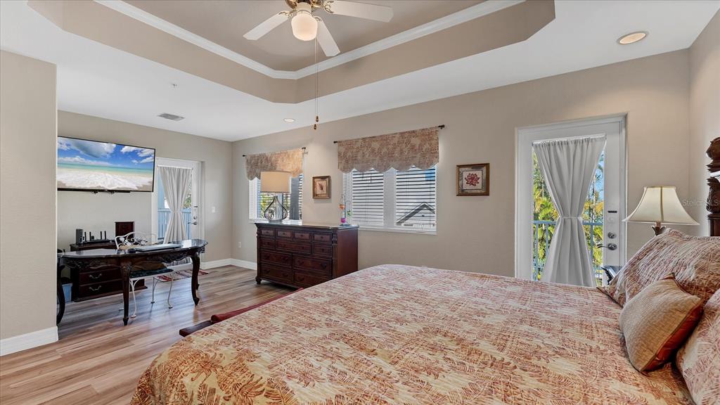 2245 North Beach Road, Unit 203 Englewood, FL 34223 - Photo 18 of 55 a bedroom with a bed and a dresser