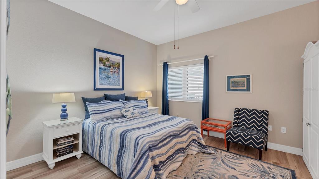 2245 North Beach Road, Unit 203 Englewood, FL 34223 - Photo 22 of 55 a bedroom with bed and a window