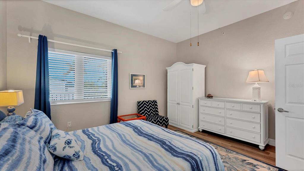 2245 North Beach Road, Unit 203 Englewood, FL 34223 - Photo 24 of 55 a bedroom with a bed and a window