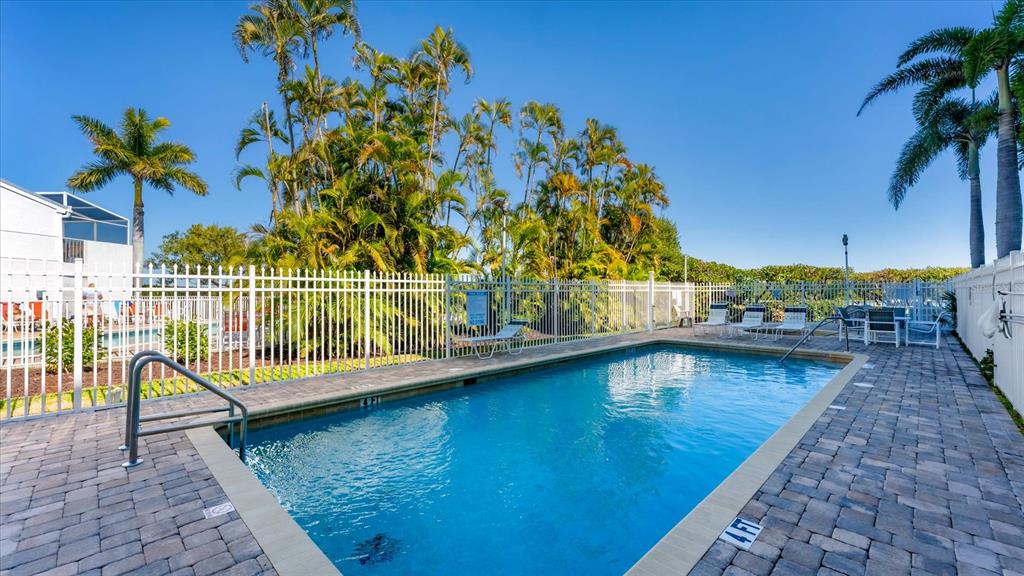2245 North Beach Road, Unit 203 Englewood, FL 34223 - Photo 30 of 55 a view of a swimming pool with a lake