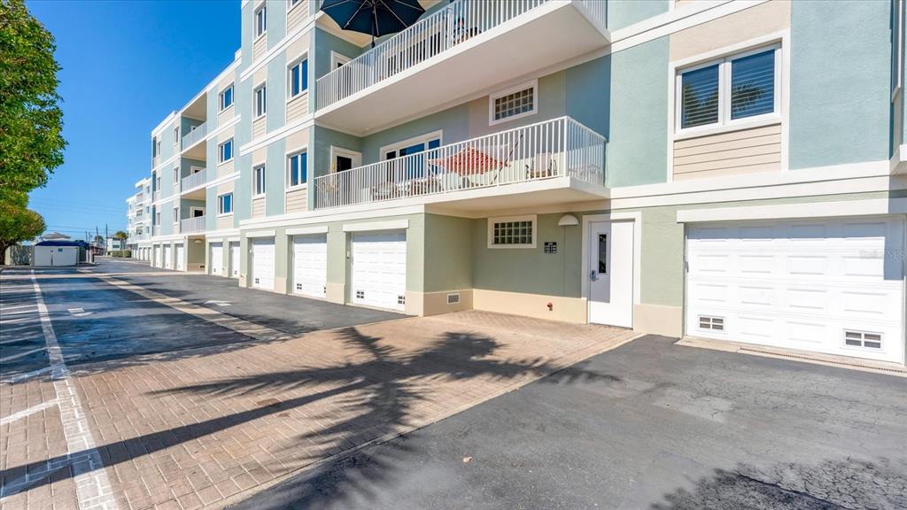 2245 North Beach Road, Unit 203 Englewood, FL 34223 - Photo 3 of 55 a view of a building with a outdoor space