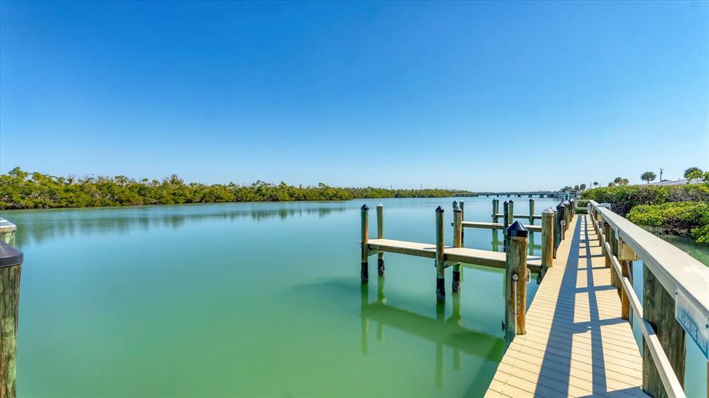 2245 North Beach Road, Unit 203 Englewood, FL 34223 - Photo 37 of 55 a view of a lake with a outdoor space