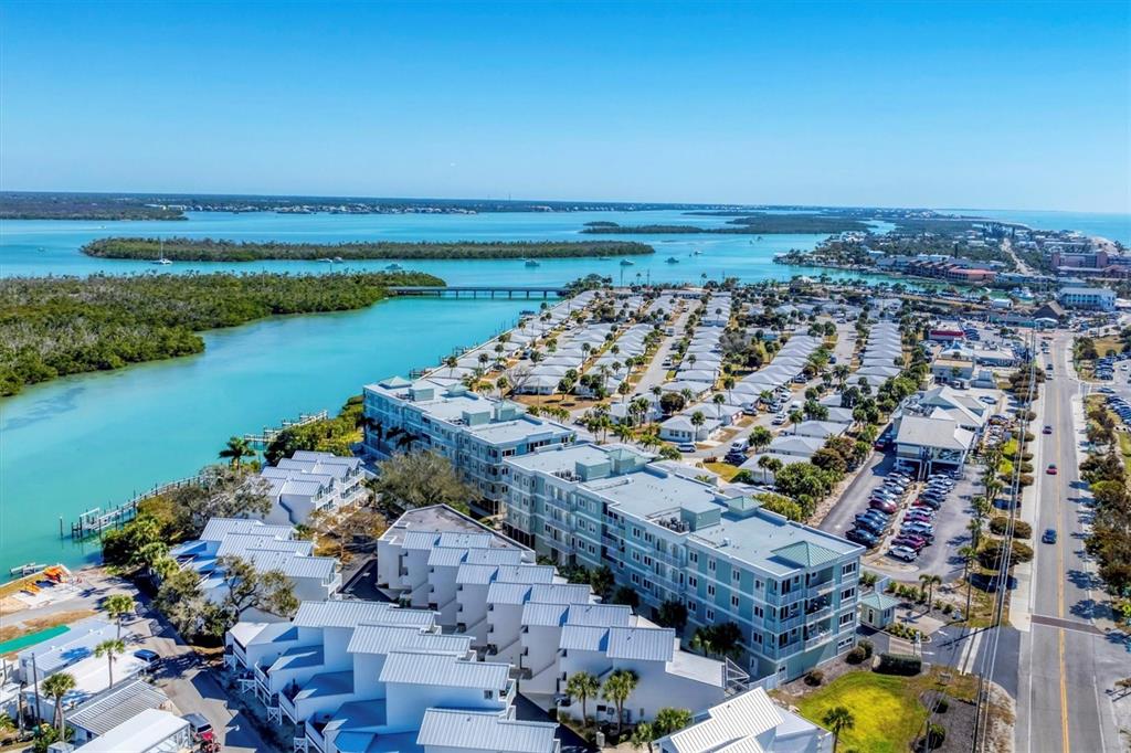 2245 North Beach Road, Unit 203 Englewood, FL 34223 - Photo 43 of 55 an aerial view of ocean and residential houses with outdoor space