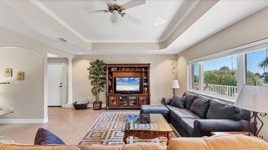 2245 North Beach Road, Unit 203 Englewood, FL 34223 - Photo 5 of 55 a living room with furniture and a large window