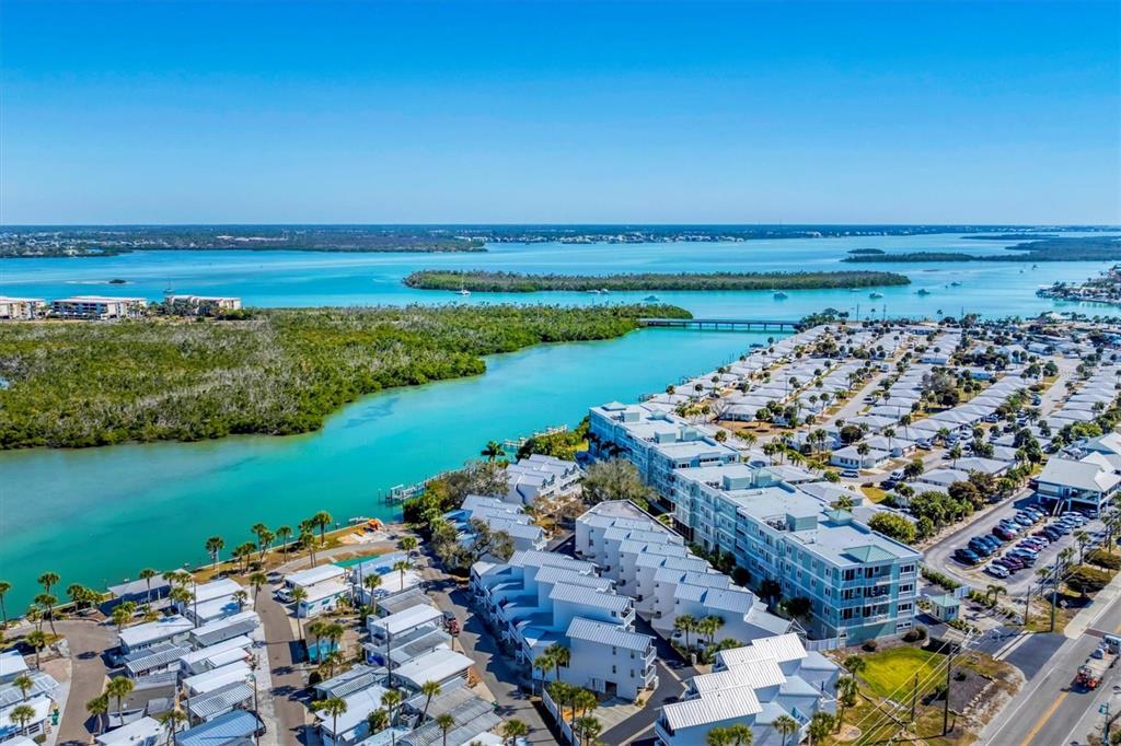 2245 North Beach Road, Unit 203 Englewood, FL 34223 - Photo 52 of 55 a view of a lake with a beach