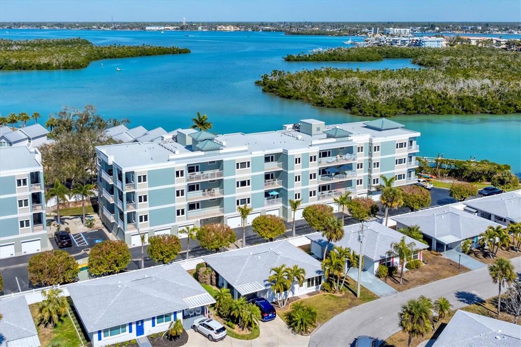 2245 North Beach Road, Unit 203 Englewood, FL 34223 - Photo 55 of 55 an aerial view of a house with a lake view