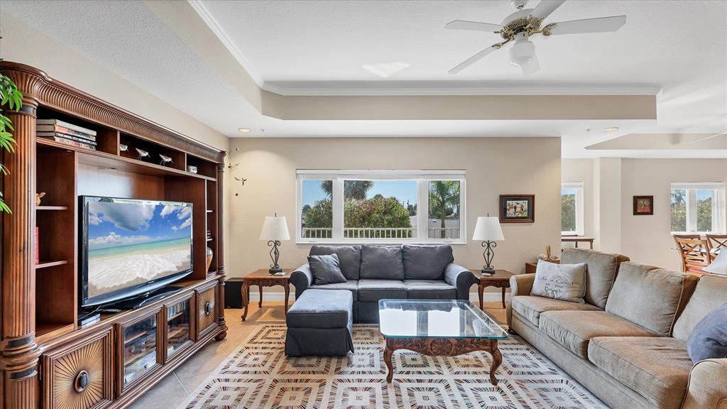 2245 North Beach Road, Unit 203 Englewood, FL 34223 - Photo 6 of 55 a living room with furniture and a flat screen tv