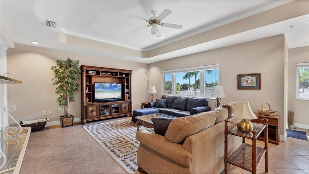 2245 North Beach Road, Unit 203 Englewood, FL 34223 - Photo 7 of 55 a living room with furniture and a flat screen tv