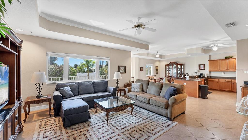 2245 North Beach Road, Unit 203 Englewood, FL 34223 - Photo 9 of 55 a living room with furniture and a flat screen tv