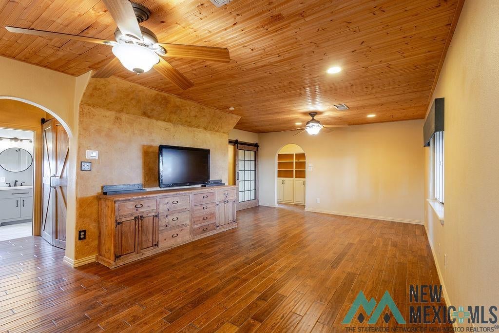 1131 Curry Road North Clovis, NM 88101 - Photo 35 of 69 Spacious room featuring wood-finish flooring, wood plank ceiling, and recessed lighting