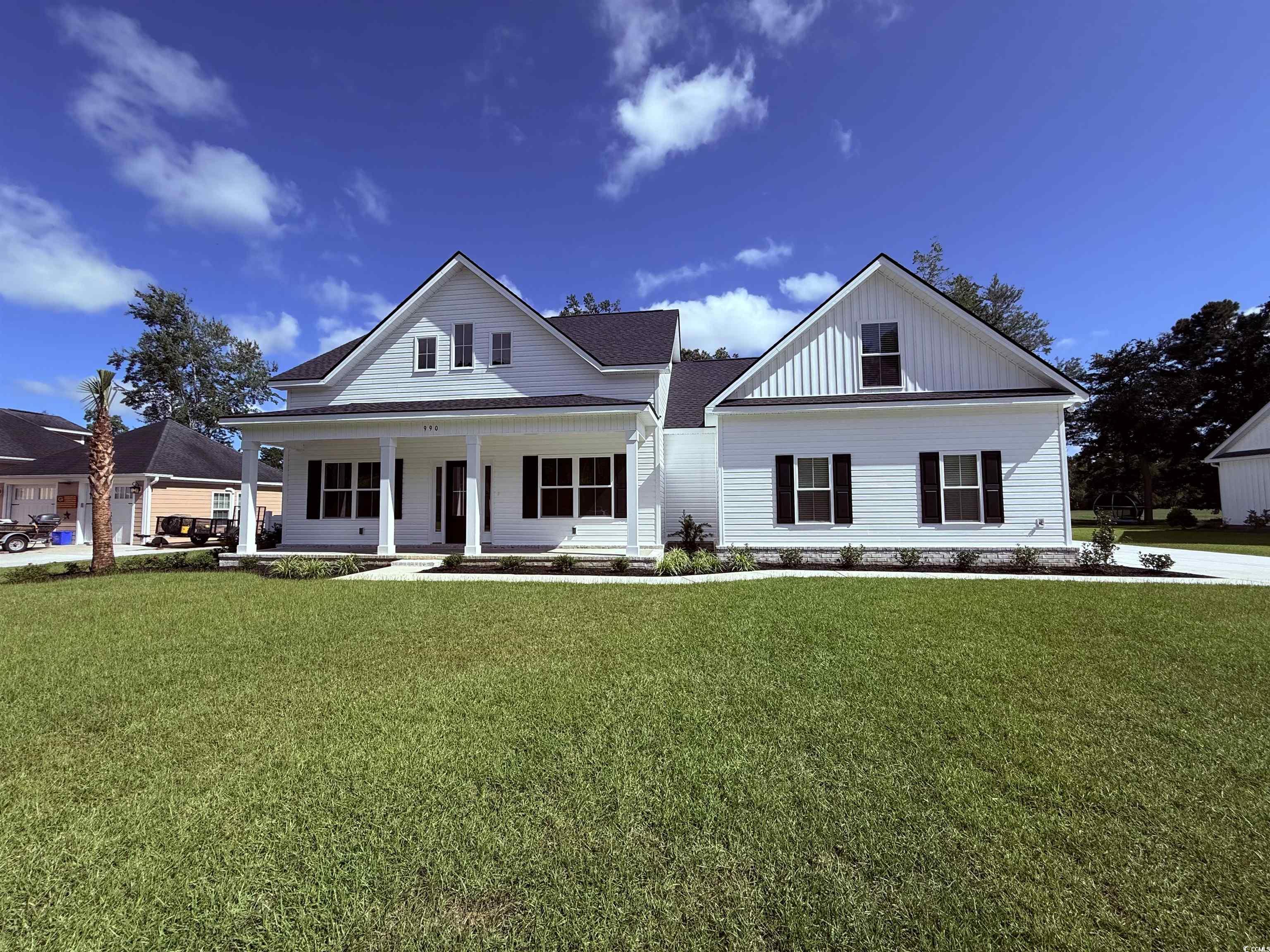 990 Francis Parker Road Georgetown, SC 29440 - Photo 1 of 2 Modern inspired farmhouse featuring covered porch,