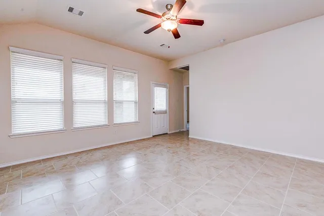 a view of an empty room with a window
