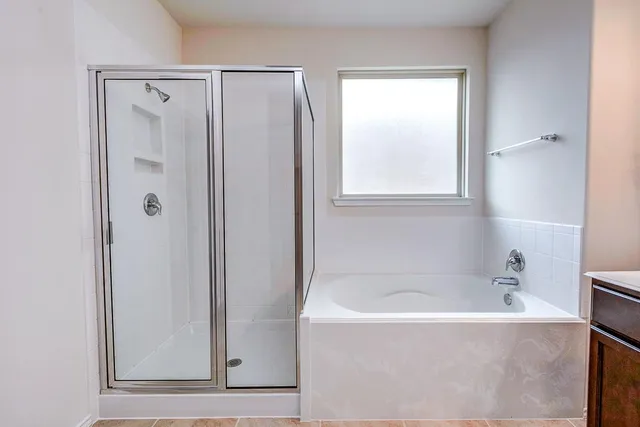 a white bath tub sitting next to a window