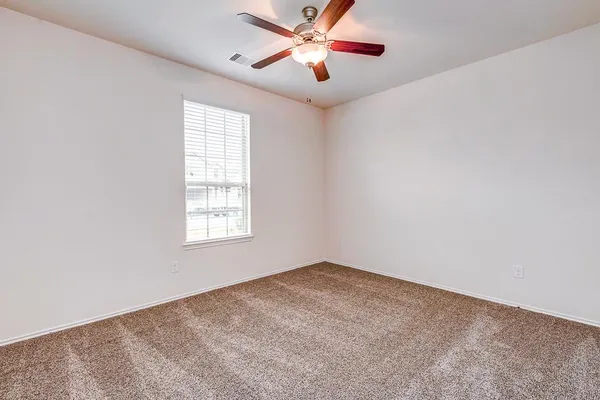 a view of a big room with carpet