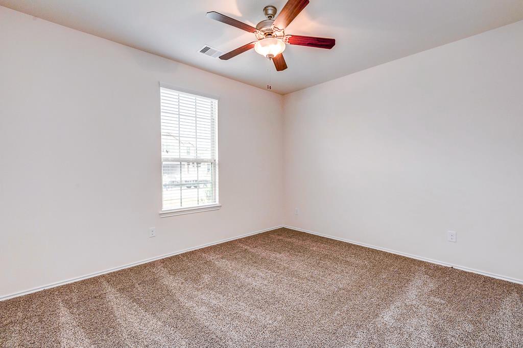 24314 North Newcastle Bay Trail Spring, TX 77389 - Photo 5 of 32 a view of a big room with carpet