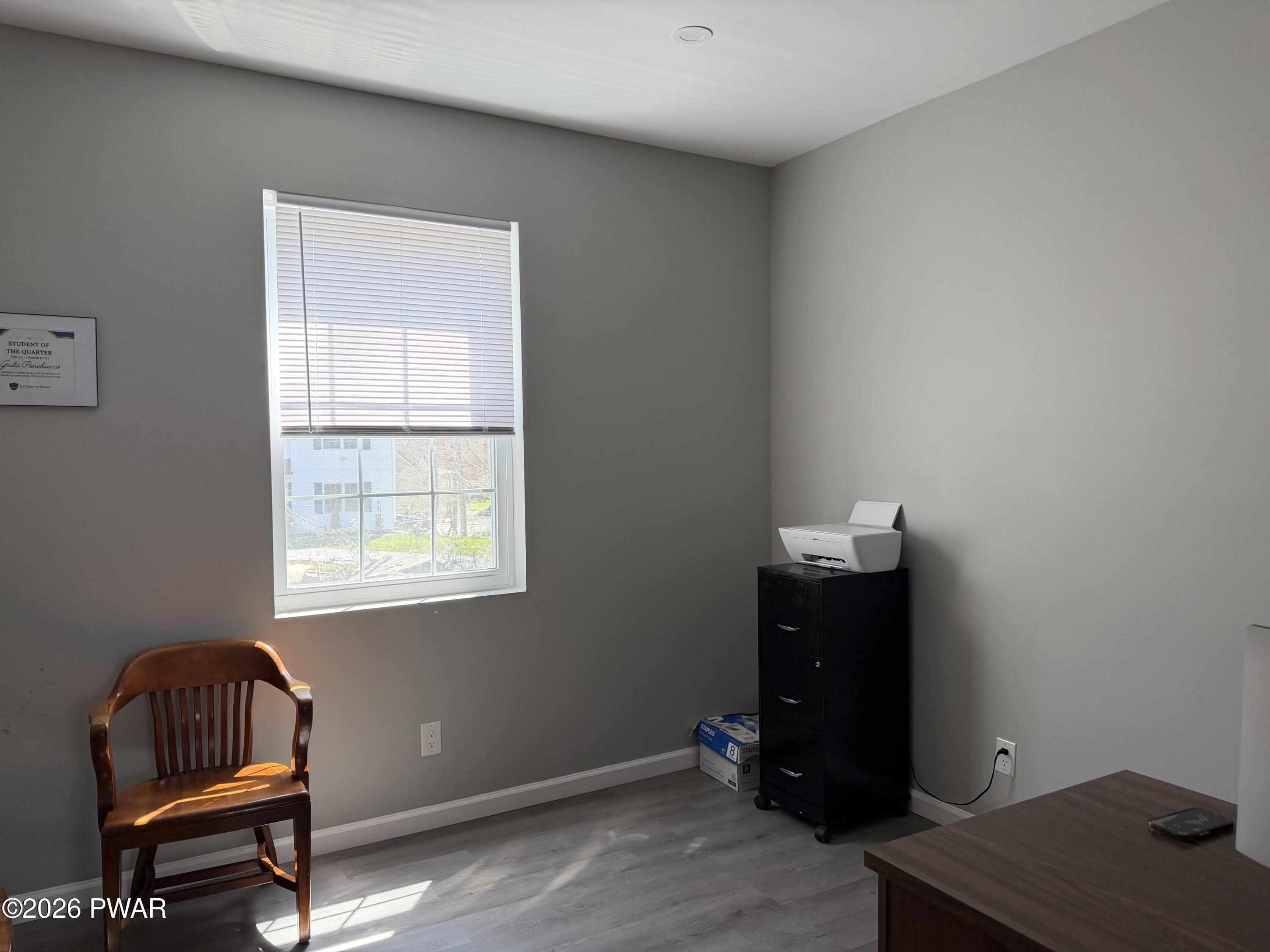 801 Maple Ridge Court Hawley, PA 18428 - Photo 29 of 55 a room with a desk and chair