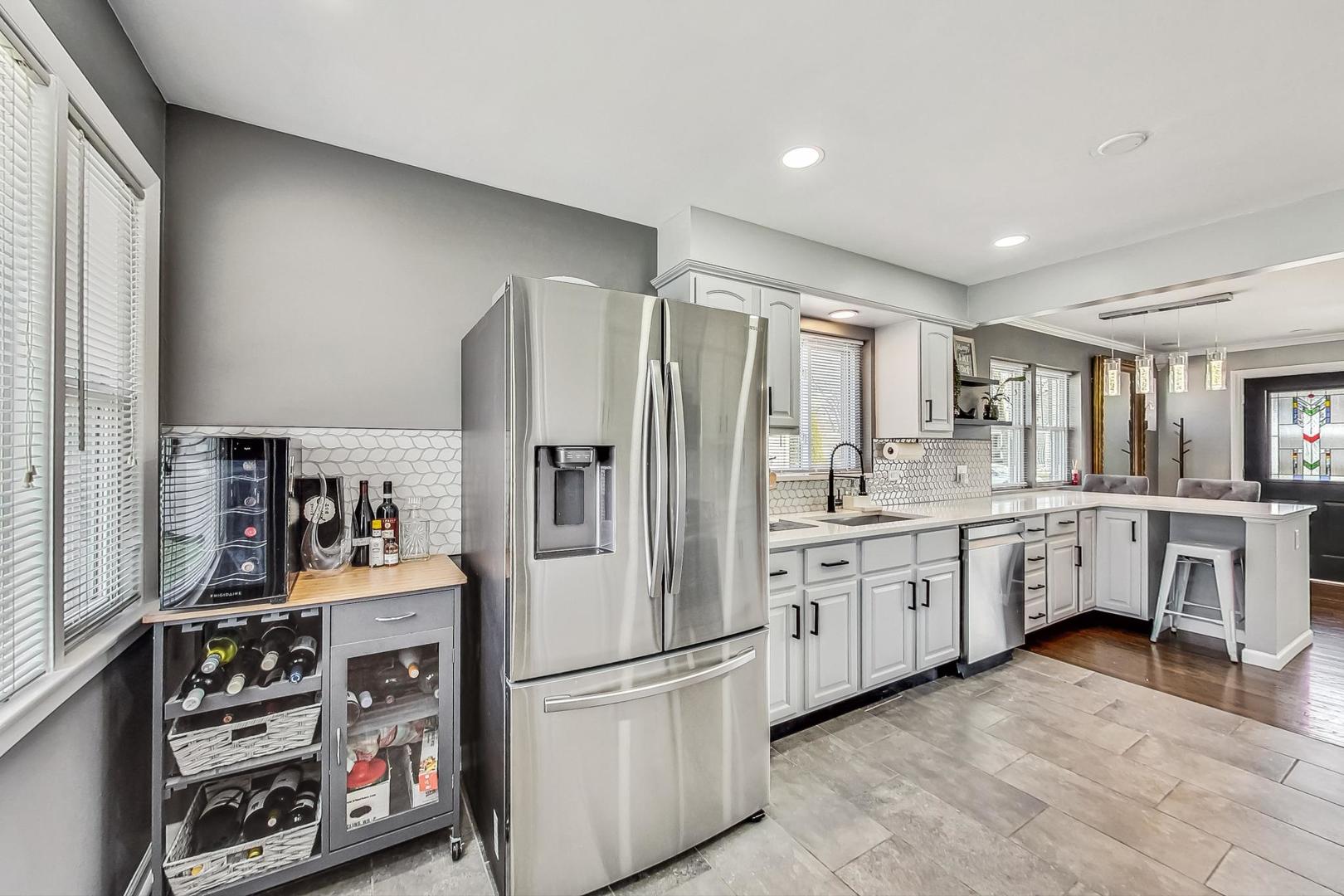 824 Florence Drive Park Ridge, IL 60068 - Photo 11 of 45 a kitchen with stainless steel appliances a refrigerator sink and white cabinets