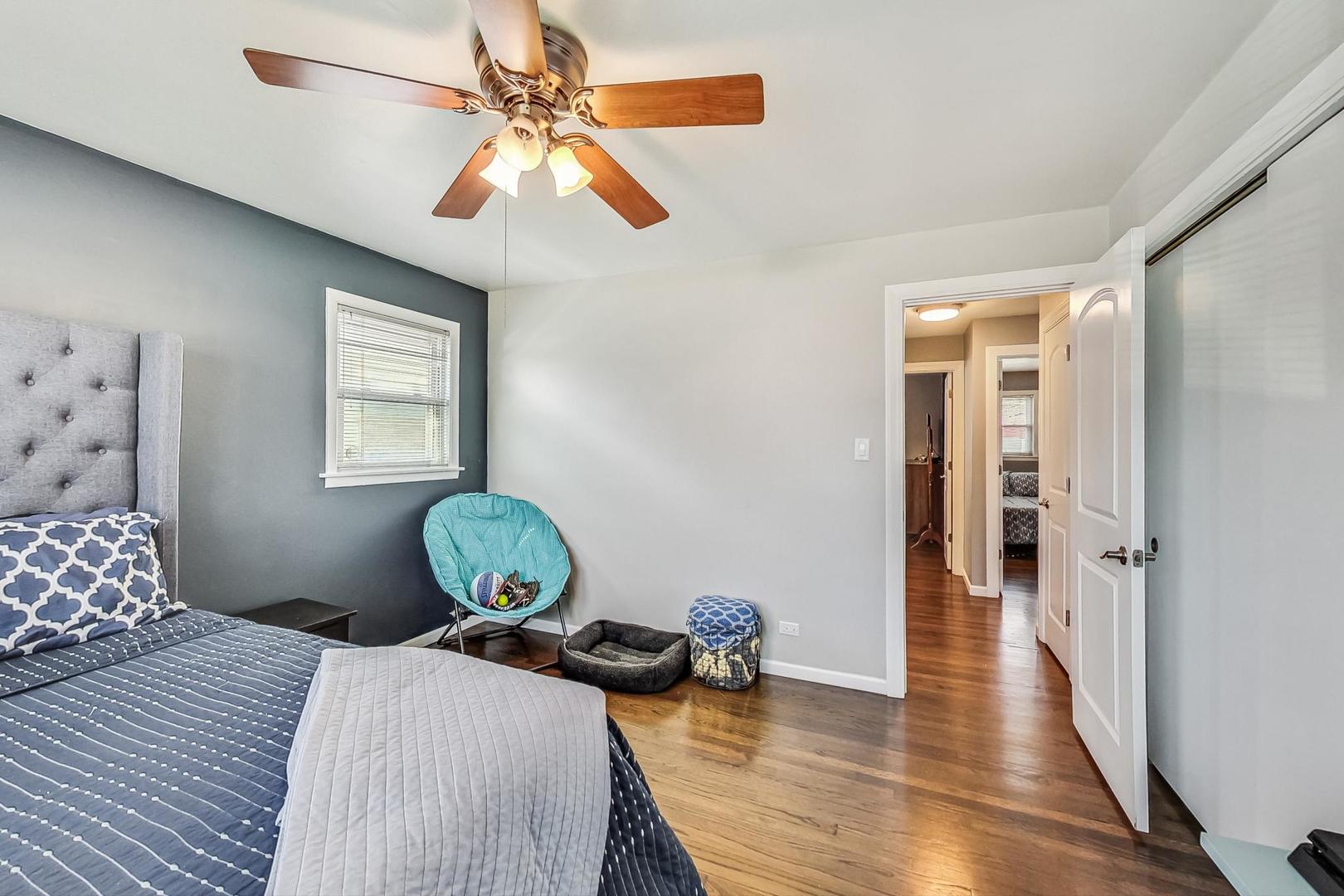 824 Florence Drive Park Ridge, IL 60068 - Photo 15 of 45 a bedroom with a bed and wooden floor