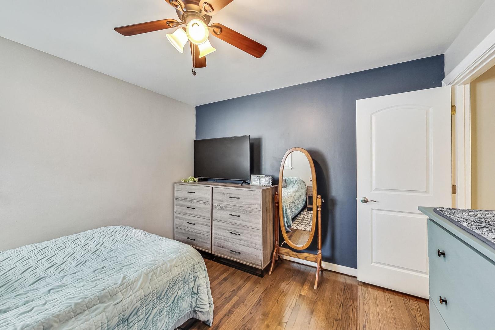 824 Florence Drive Park Ridge, IL 60068 - Photo 18 of 45 a bedroom with a bed and a flat screen tv