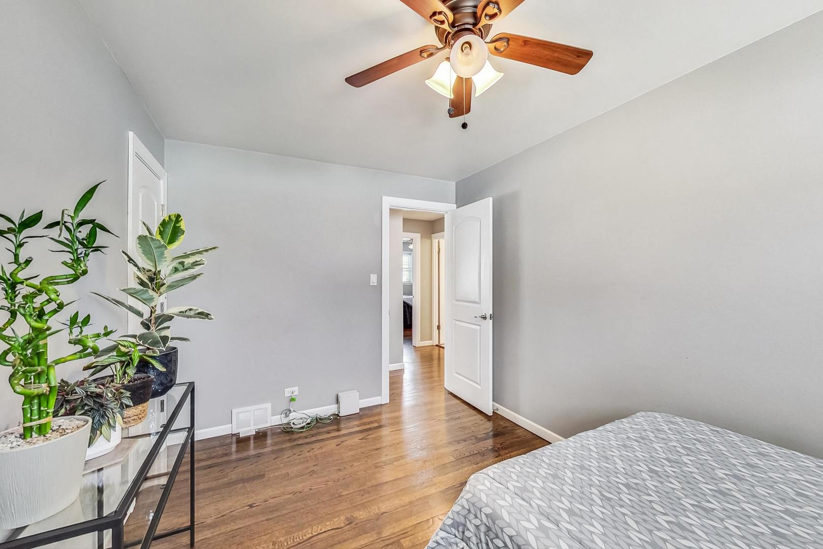 824 Florence Drive Park Ridge, IL 60068 - Photo 20 of 45 a bedroom with a bed and a potted plant