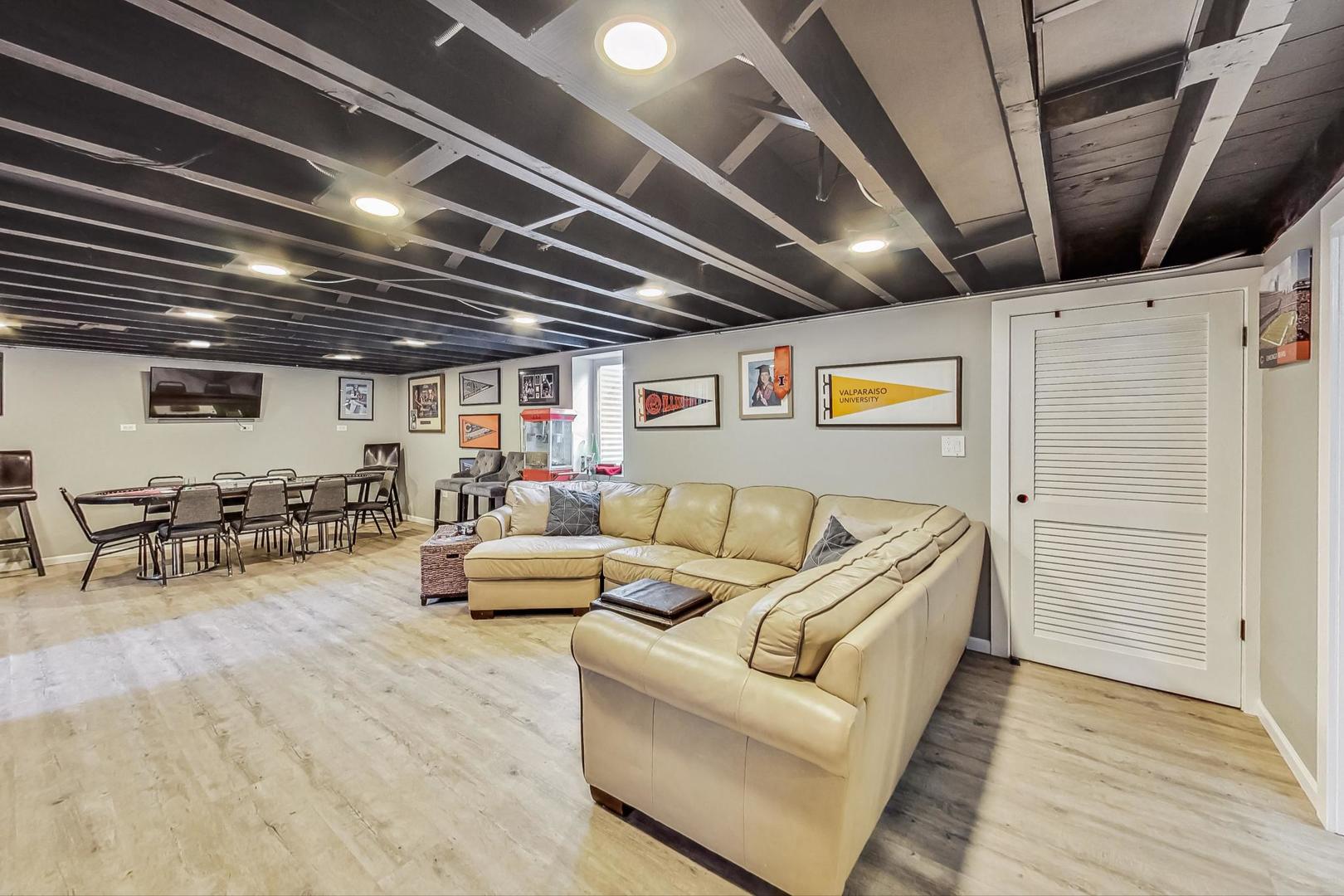 824 Florence Drive Park Ridge, IL 60068 - Photo 24 of 45 a living room with furniture and a chandelier