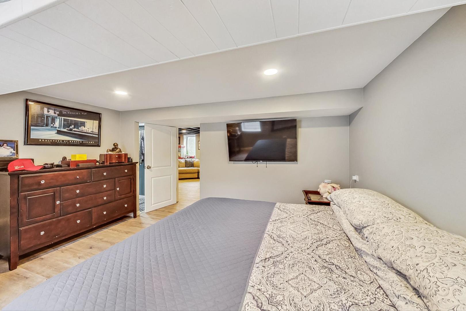 824 Florence Drive Park Ridge, IL 60068 - Photo 31 of 45 a bedroom with a bed and a flat screen tv