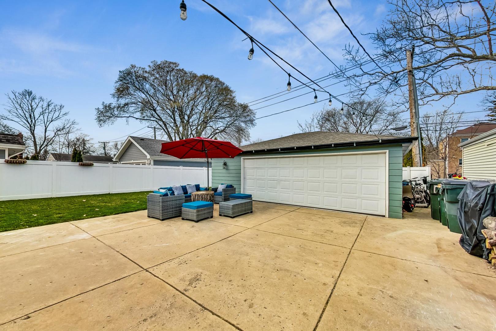 824 Florence Drive Park Ridge, IL 60068 - Photo 36 of 45 a view of a house with a patio and a yard