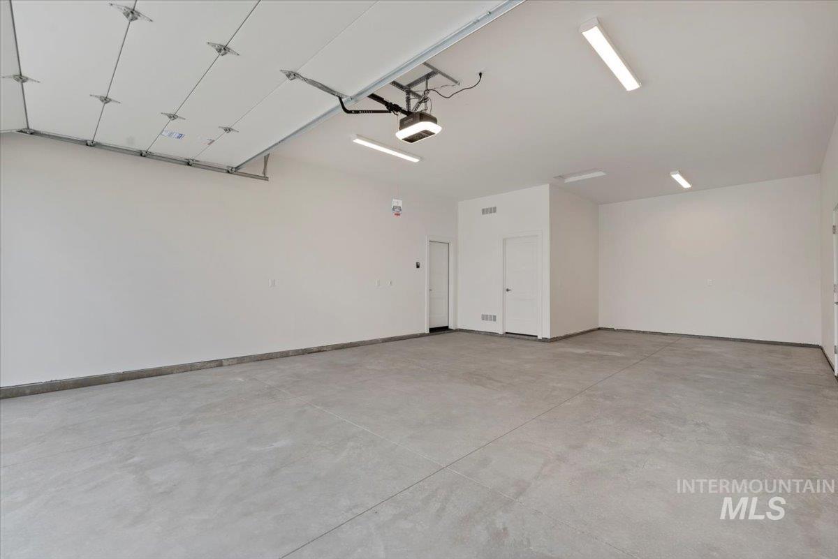 1297 Chena Street Middleton, ID 83644 - Photo 32 of 38 Garage featuring baseboards