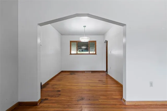 a kitchen with a sink appliances and cabinets
