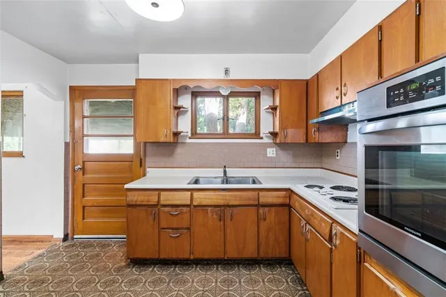 a room with mirror and a sink