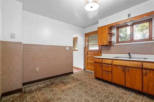 a view of hallway with wooden floor