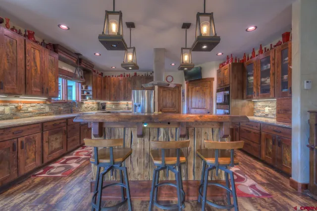 a kitchen with a table and chairs in it