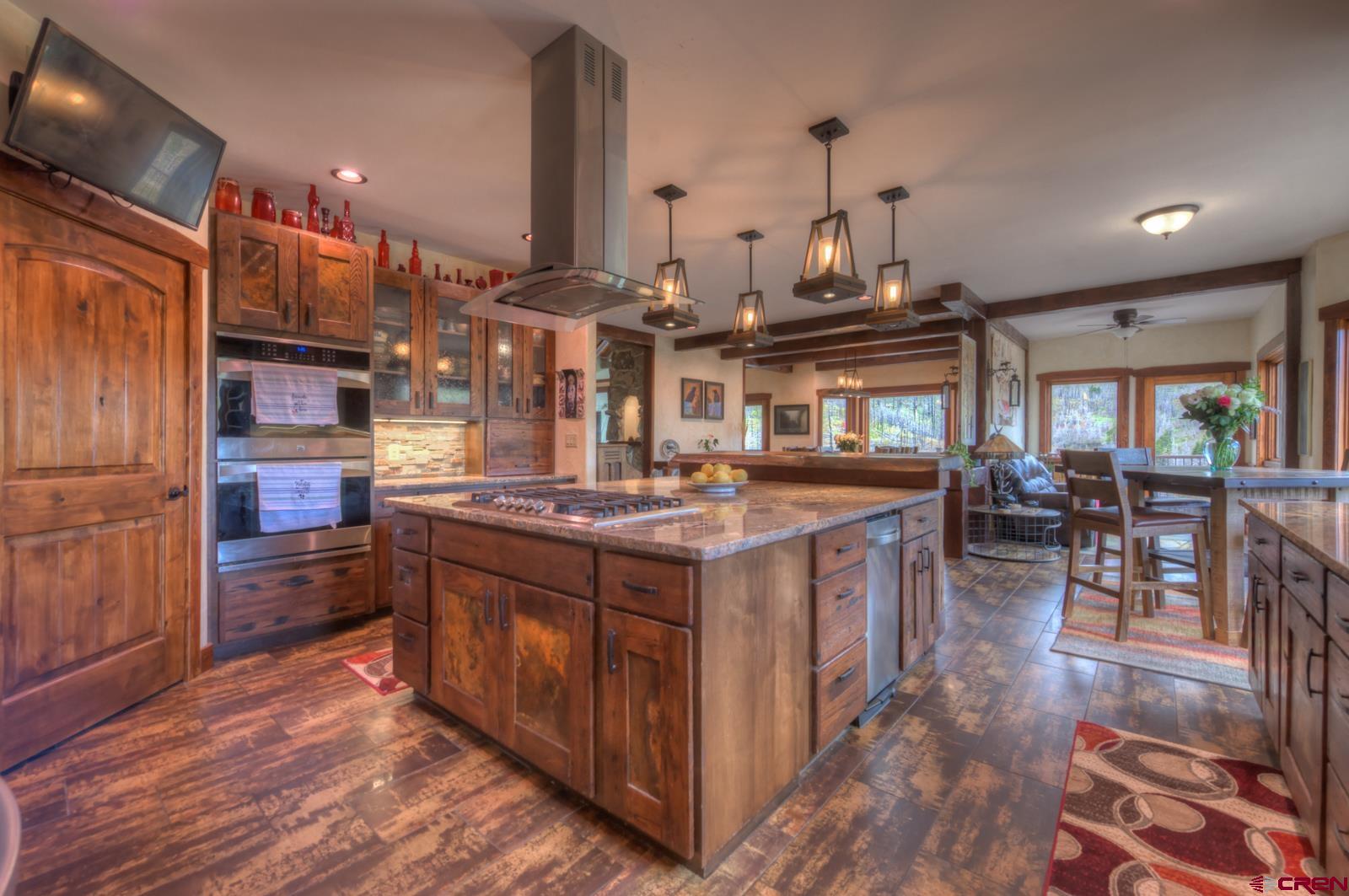 1833 Yellowstone Creek Road Walsenburg, CO 81089 - Photo 13 of 44 a kitchen with stainless steel appliances granite countertop a stove and cabinets