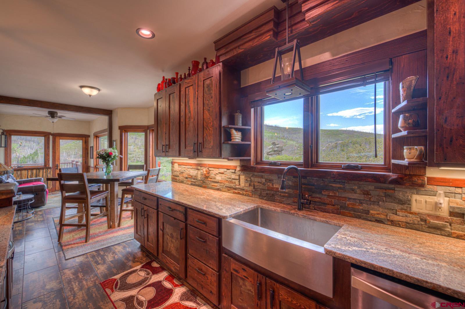 1833 Yellowstone Creek Road Walsenburg, CO 81089 - Photo 18 of 44 a kitchen with lots of counter space and windows