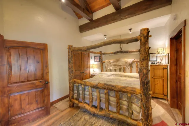 a bedroom with furniture and a window