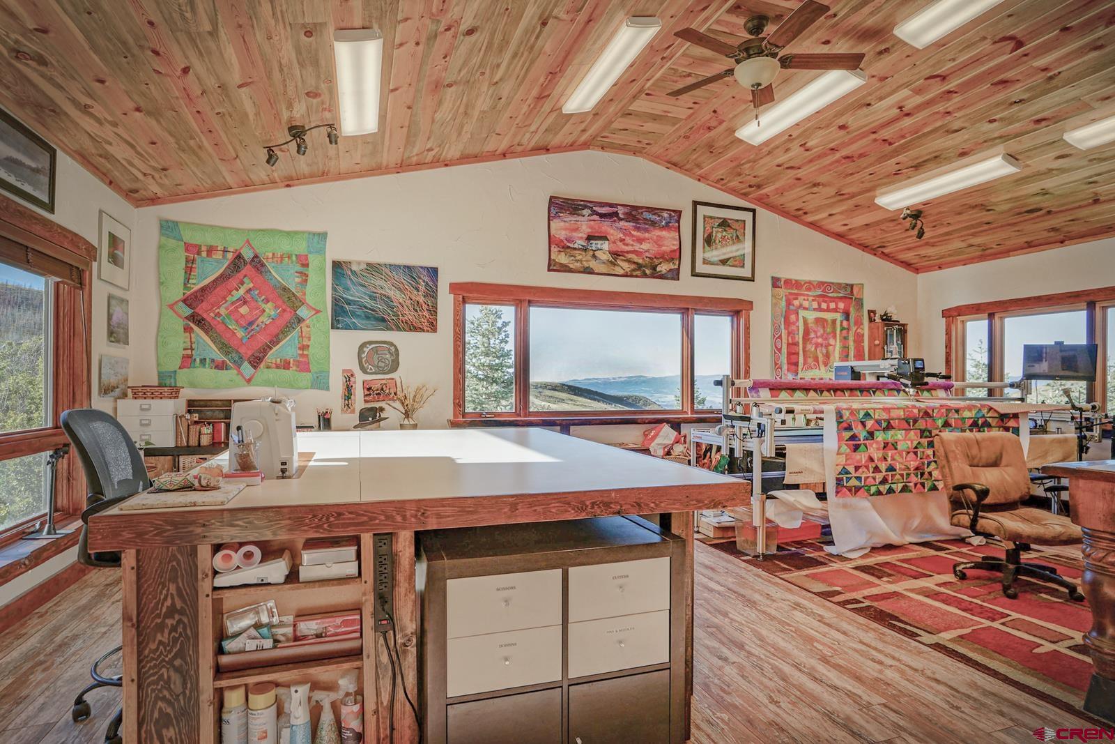 1833 Yellowstone Creek Road Walsenburg, CO 81089 - Photo 36 of 44 a room with furniture and wooden floor