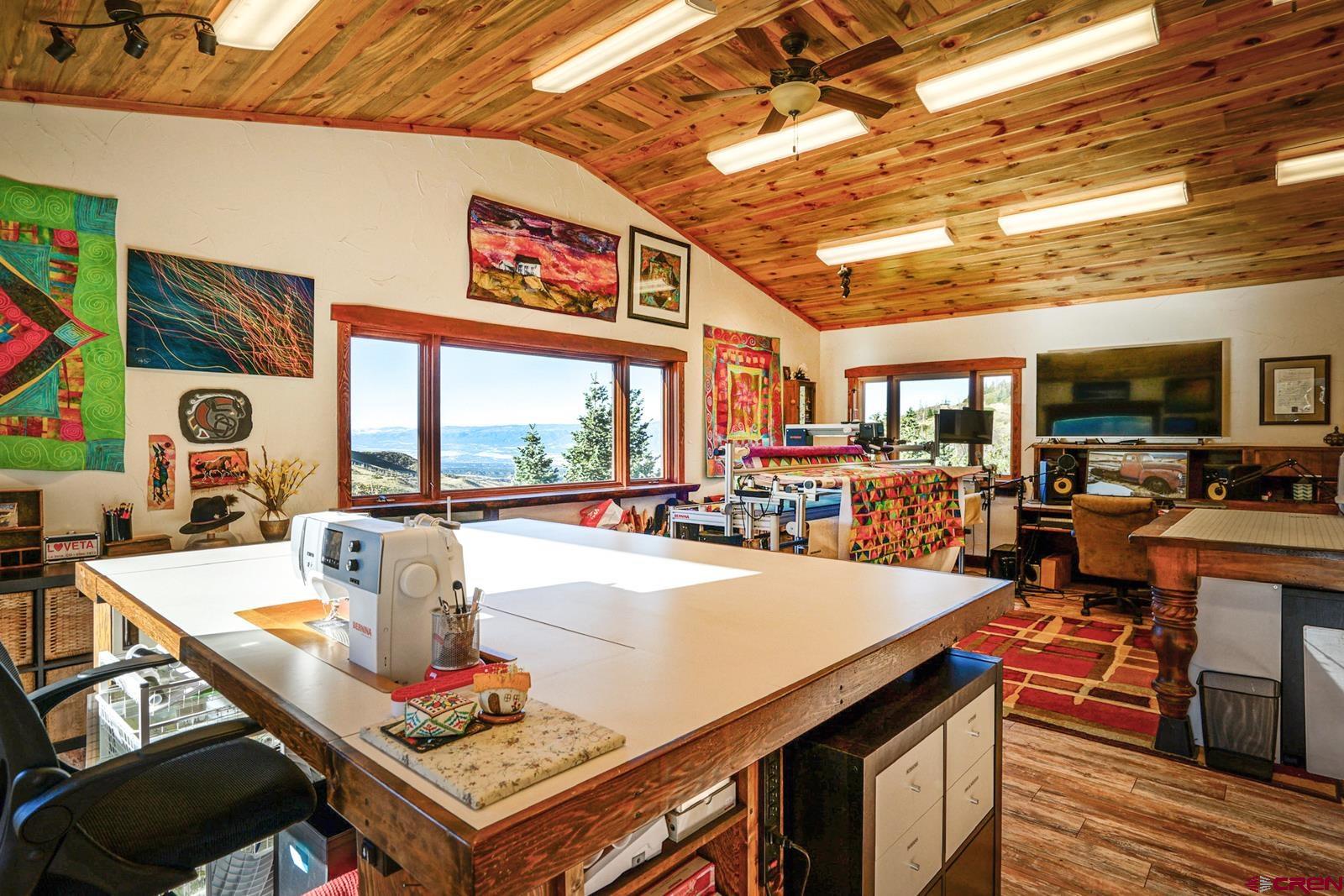 1833 Yellowstone Creek Road Walsenburg, CO 81089 - Photo 40 of 44 a living room with stainless steel appliances furniture a rug and a large window