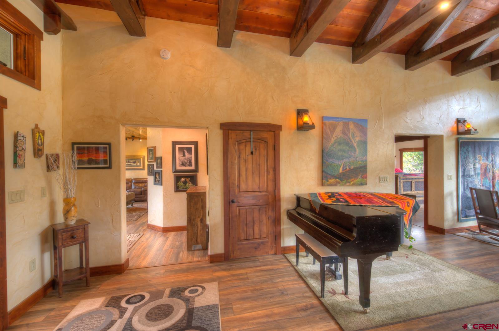 1833 Yellowstone Creek Road Walsenburg, CO 81089 - Photo 4 of 44 a room with furniture and wooden floor