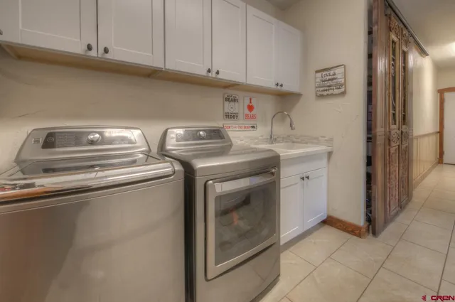 a view of a bedroom with wooden floor and windows