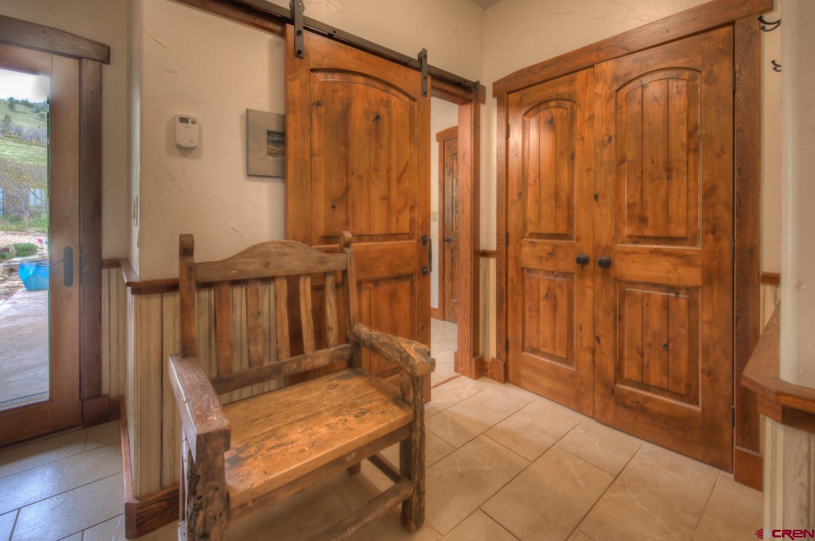 1833 Yellowstone Creek Road Walsenburg, CO 81089 - Photo 42 of 44 a view of a bedroom with wooden floor and windows