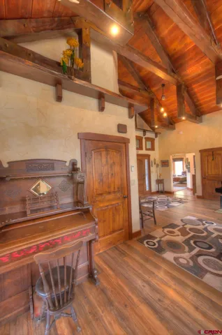 a view of a room with wooden floor