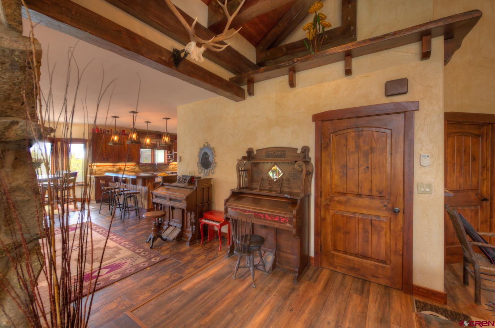 1833 Yellowstone Creek Road Walsenburg, CO 81089 - Photo 10 of 44 a workspace with wooden floor