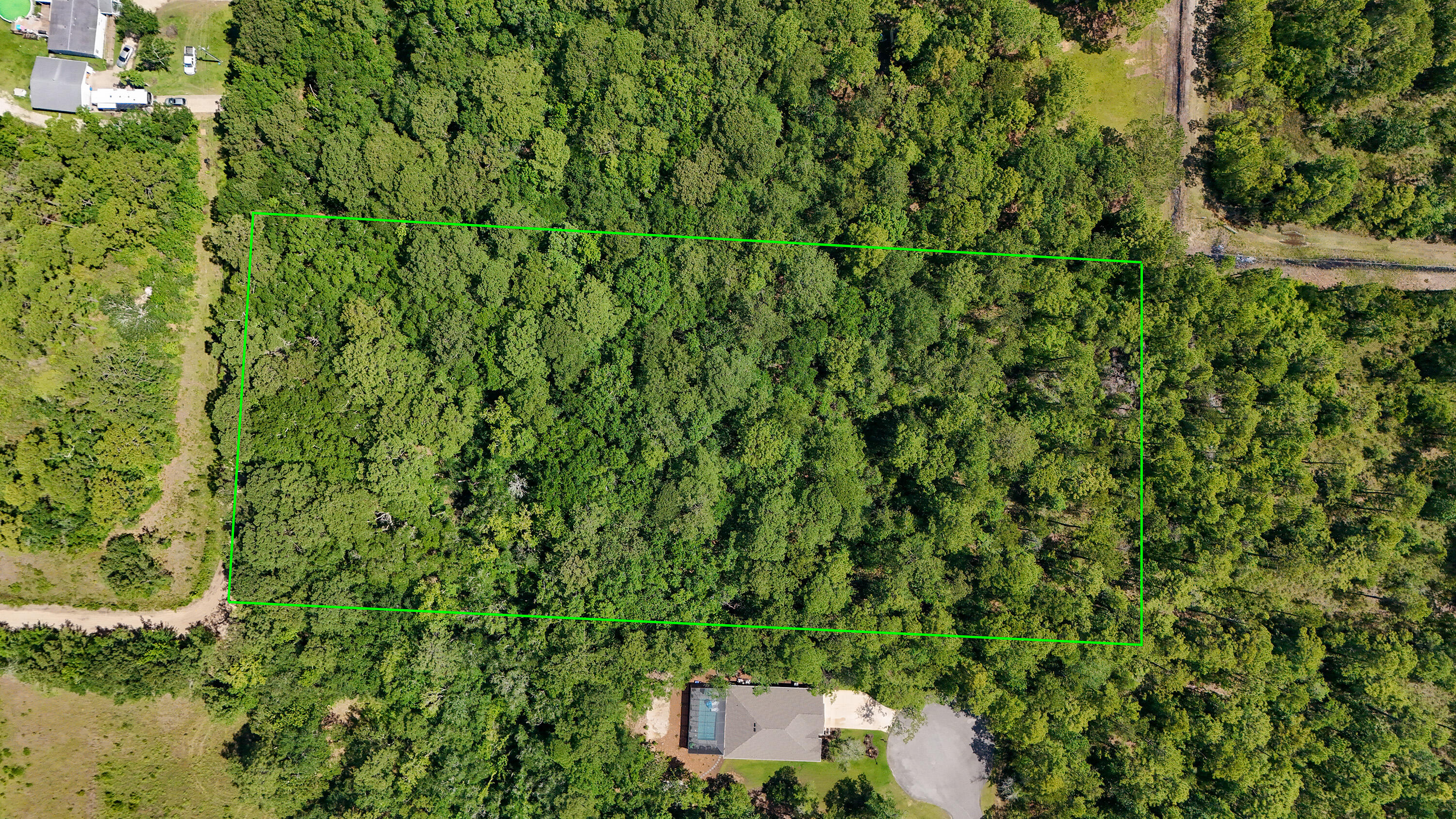 4.66-acres Watson Road Freeport, FL 32439 - Photo 4 of 8 a view of a house with a tree