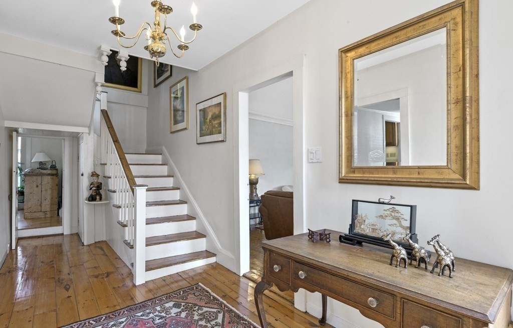 80 Front Street Marblehead, MA 01945 - Photo 14 of 42 a view of a livingroom with wooden floor and stairs