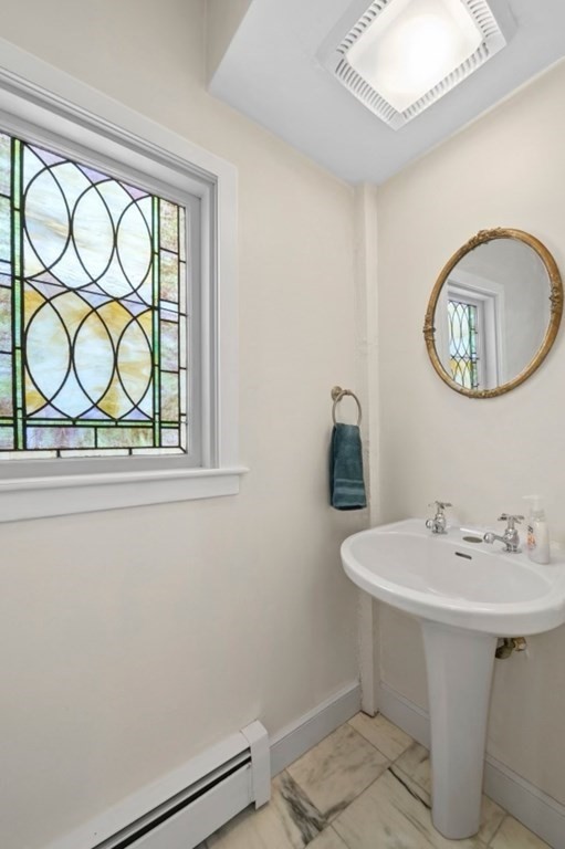 80 Front Street Marblehead, MA 01945 - Photo 18 of 42 a bathroom with a sink and a mirror