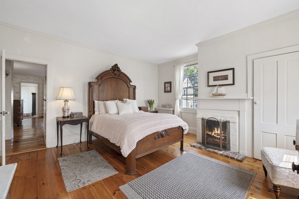 80 Front Street Marblehead, MA 01945 - Photo 26 of 42 a bed room with a bed and a fireplace